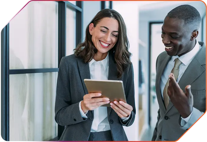 Men and women are looking at a tablet